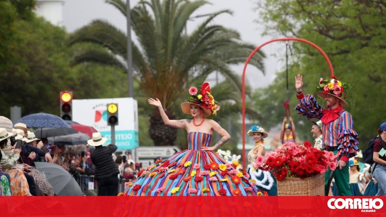 Thousands of people watch the Flower Festival parade in Madeira despite the rain