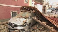 Blanket of tiles covers streets in Figueira da Foz. Roof of former international university blown off, destroying nearby buildings and cars