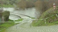 Rising river flow leaves bridge completely submerged in Mirandela