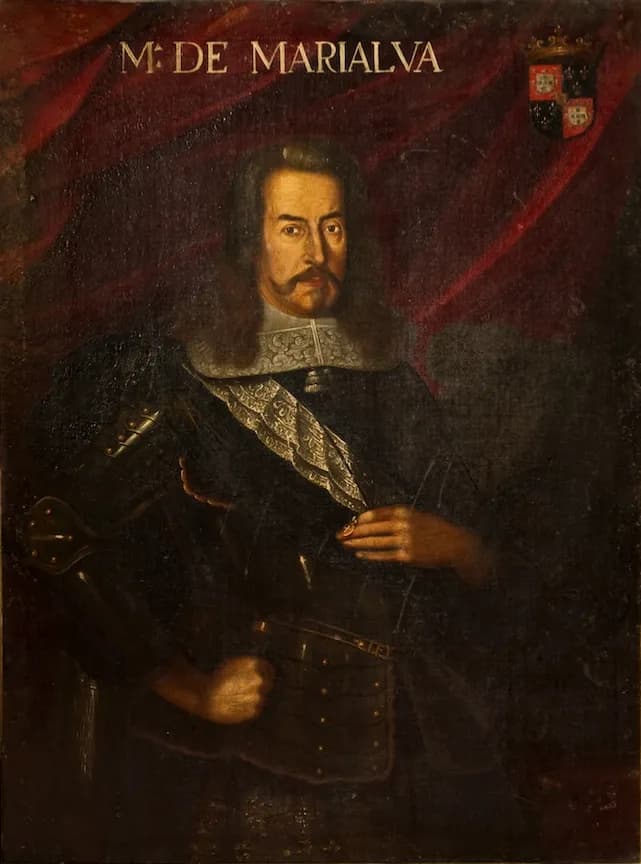 A painted portrait of a man with long greying hair and a moustache, in dark armour with a lace collar and cravat, one hand on his hip, against a red curtain. The words M. de Marialva and a coat of arms are painted at the top.