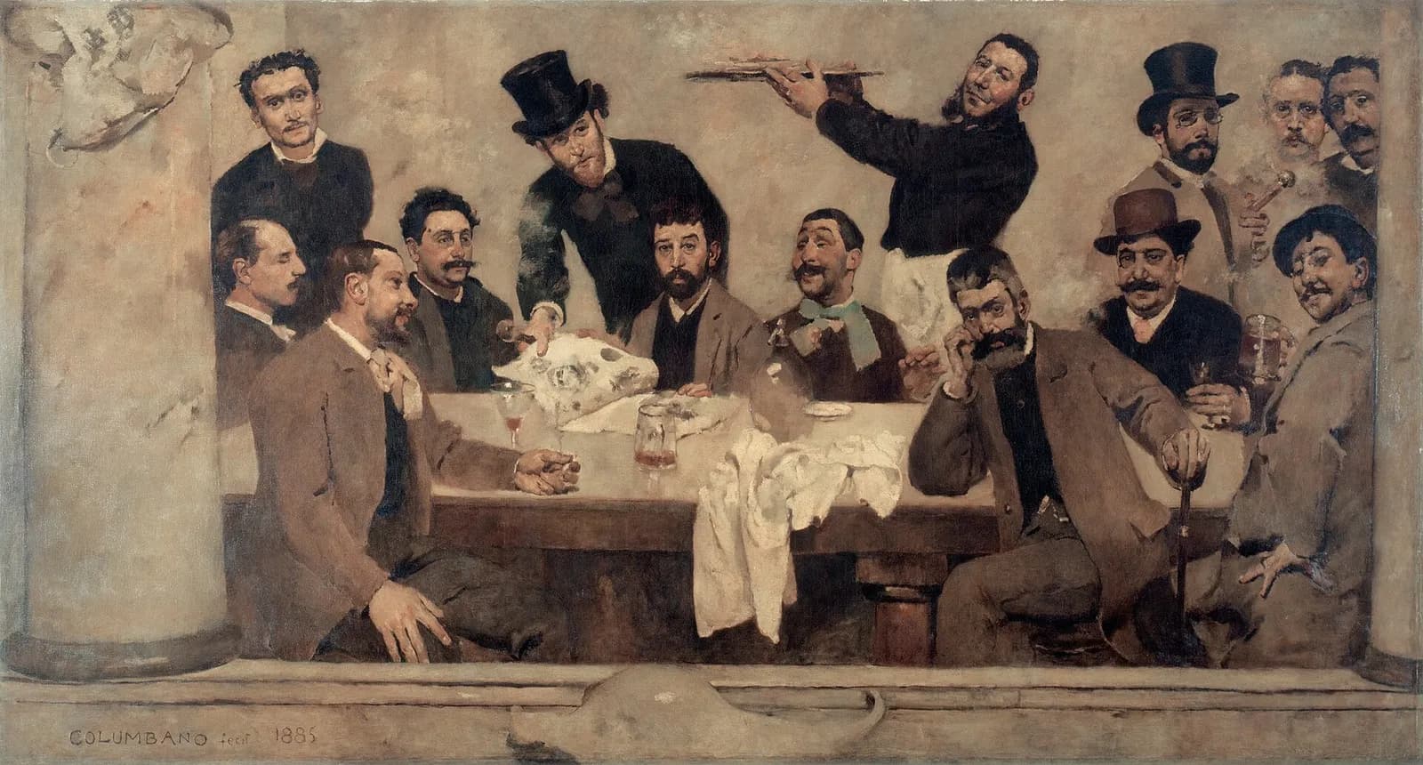 A wide painting of fourteen men around a long table covered with a white cloth, framed by pale stone columns on either side. Some sit, some stand behind; two wear top hats, a waiter in a white apron holds a tray up high, and several men hold glasses. The words COLUMBANO fecit 1885 are painted at the lower left.
