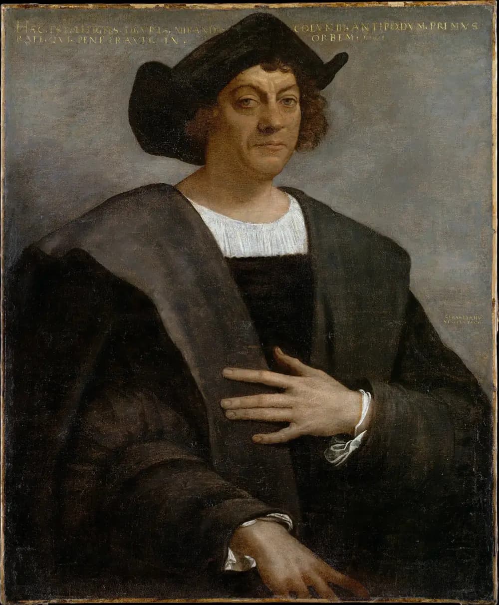 Half-length portrait of a heavy-set man with curly reddish-brown hair under a broad black hat, wearing a dark cloak over a white shirt, one hand laid on his chest. A Latin inscription in gold runs across the top of the grey background.
