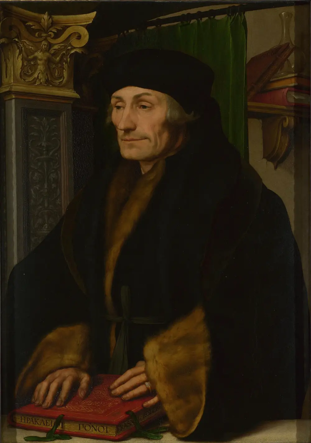 Half-length painted portrait of an elderly man in a black fur-trimmed coat and black cap, his hands resting on a book, beside a carved Renaissance pilaster and a green curtain.