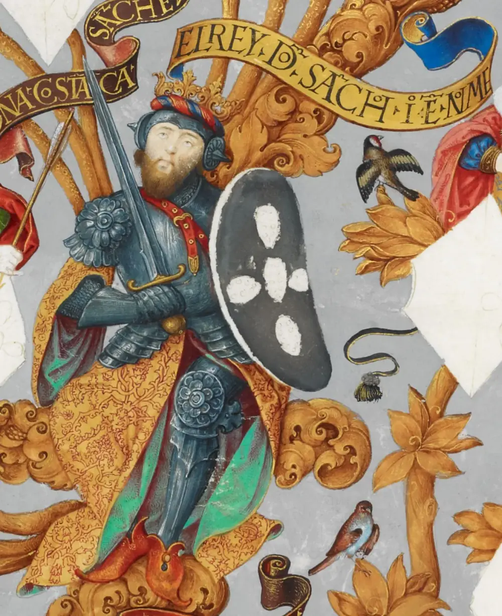 A painted miniature of a bearded king in blue-grey plate armour and a crown over a striped cap, holding a raised sword and a black shield with white spots, standing in a golden cloak among gilded foliage under a banner reading El Rey D. Sancho.