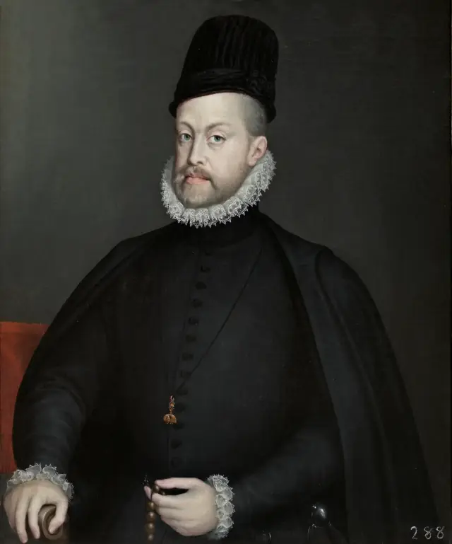 Portrait of a bearded man in black clothes, a tall black hat and a white ruff, seated and holding a rosary in his left hand.