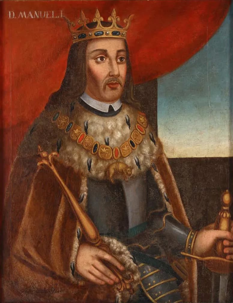 Painted portrait of a bearded king with long hair, wearing a gold crown, an ermine cape over armour and a jewelled chain, holding a sceptre, with a red curtain behind him and the words D. Manuel I at the top.