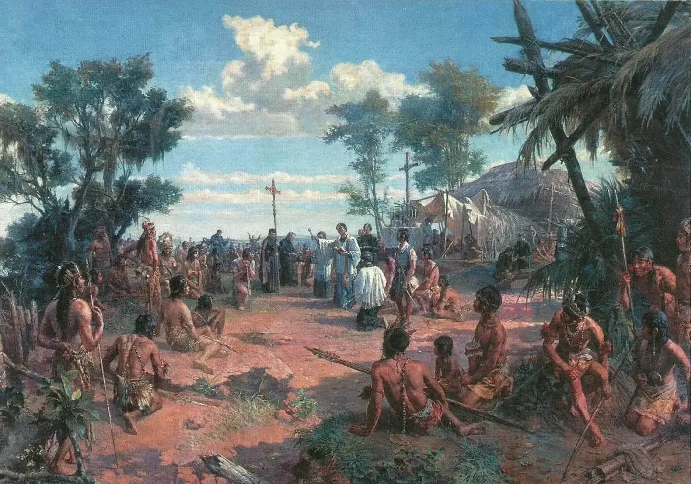A painting of an open-air Mass on a red-earth clearing under a blue sky. Priests in dark cassocks and a celebrant in white stand by a tall processional cross at the centre, with a thatched hut and a canopied altar behind them, while Indigenous men, women and children with feathers, bows and spears sit or kneel around the edges and watch.