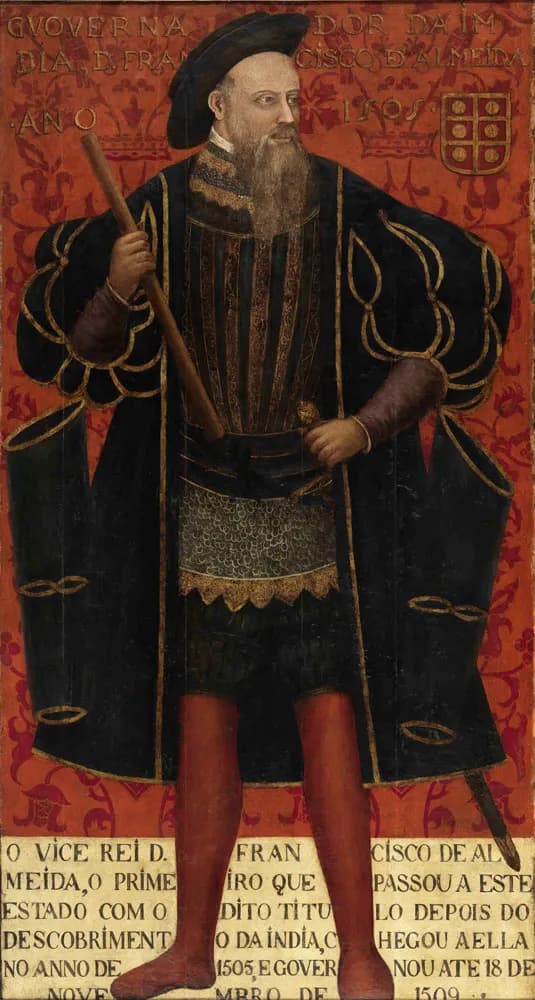Full-length painted portrait of a bearded man in a black cap and a wide black gown trimmed with gold over a mail skirt and red hose, holding a baton, against a red patterned background. A coat of arms and an inscription are painted at the top, and a long inscription in capitals at the bottom.