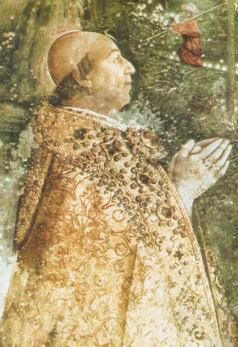 A fresco detail of an elderly tonsured man in profile, kneeling with his hands joined in prayer, wearing a gold cope thickly studded with jewels.
