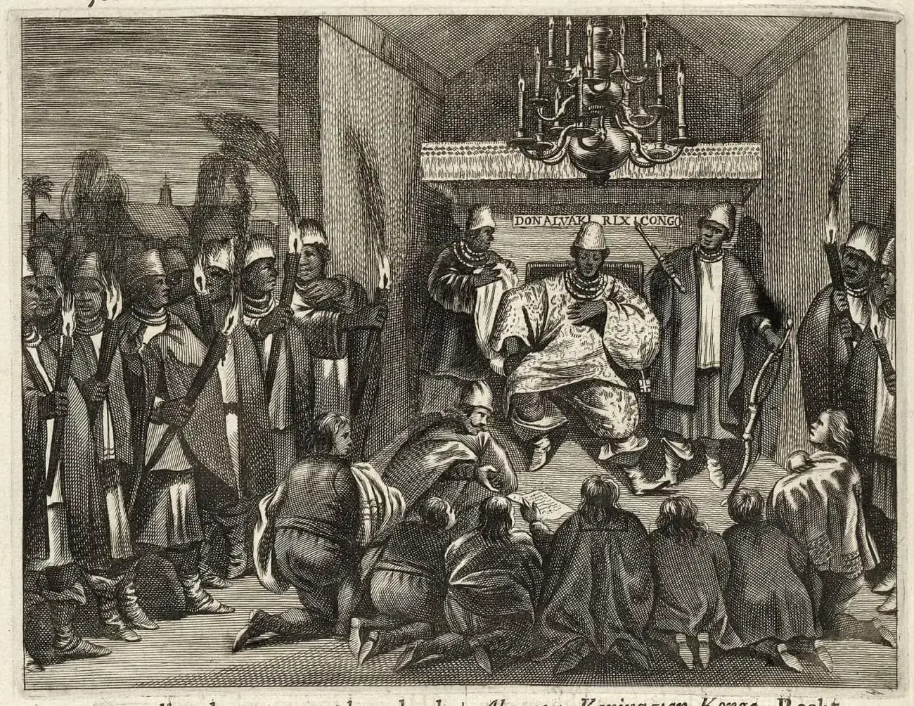 Engraving of an African king in a richly patterned robe and tall cap seated on a throne beneath a chandelier, flanked by two courtiers, while European envoys kneel before him and men holding torches stand at either side; a panel above the throne reads Don Alvari Rix Congo.