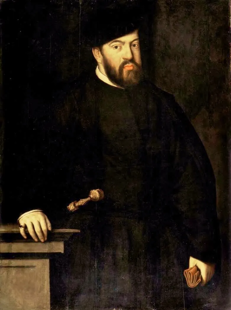 Three-quarter-length portrait of a bearded man in a black cap and black gown, his right hand resting on a stone ledge and a gold dagger hilt at his waist, against a dark background.