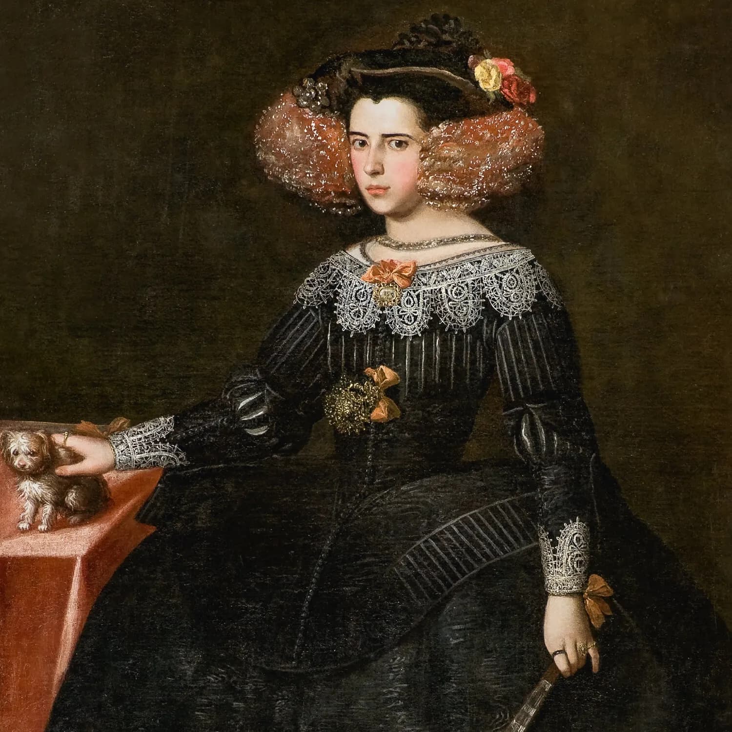 A painted portrait of a young woman with dark hair framed by a wide headdress of pink-brown curls and flowers, wearing a black dress with a broad white lace collar and orange ribbons. One hand rests on a small white and brown dog standing on a red-covered table; the other holds a closed fan.