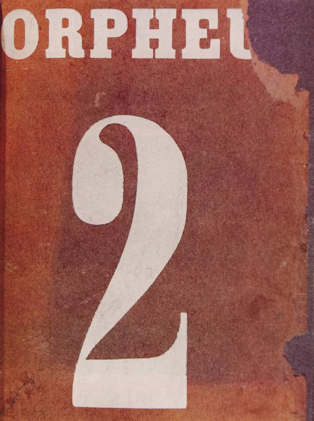 A worn magazine cover in rust red with the word ORPHEU in large white letters across the top, cut off at the right edge, and a huge white numeral 2 below.