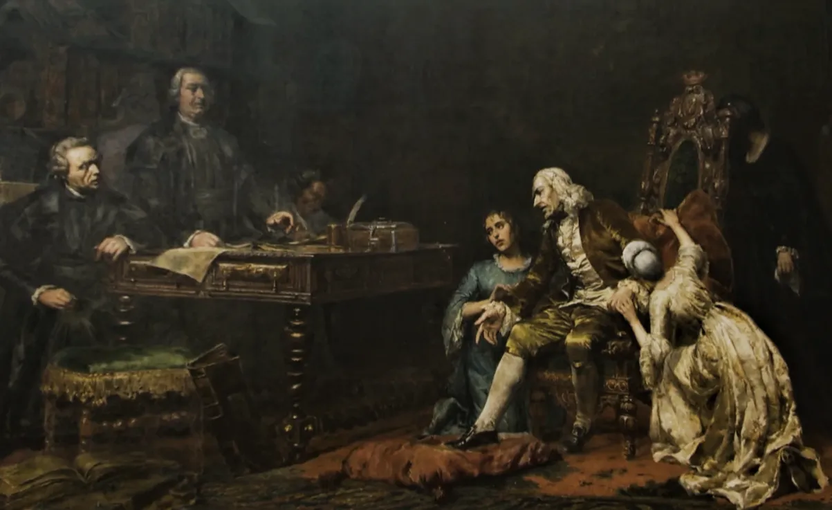 Oil painting of a dim panelled room. On the left two magistrates in dark robes, one seated and one standing, wait at a heavy table covered with papers, with a clerk writing behind them. On the right a frail old man in a white wig and brown coat leans forward from a carved chair, while a young woman in blue crouches at his side and a woman in a pale dress clings to the chair with her face hidden.