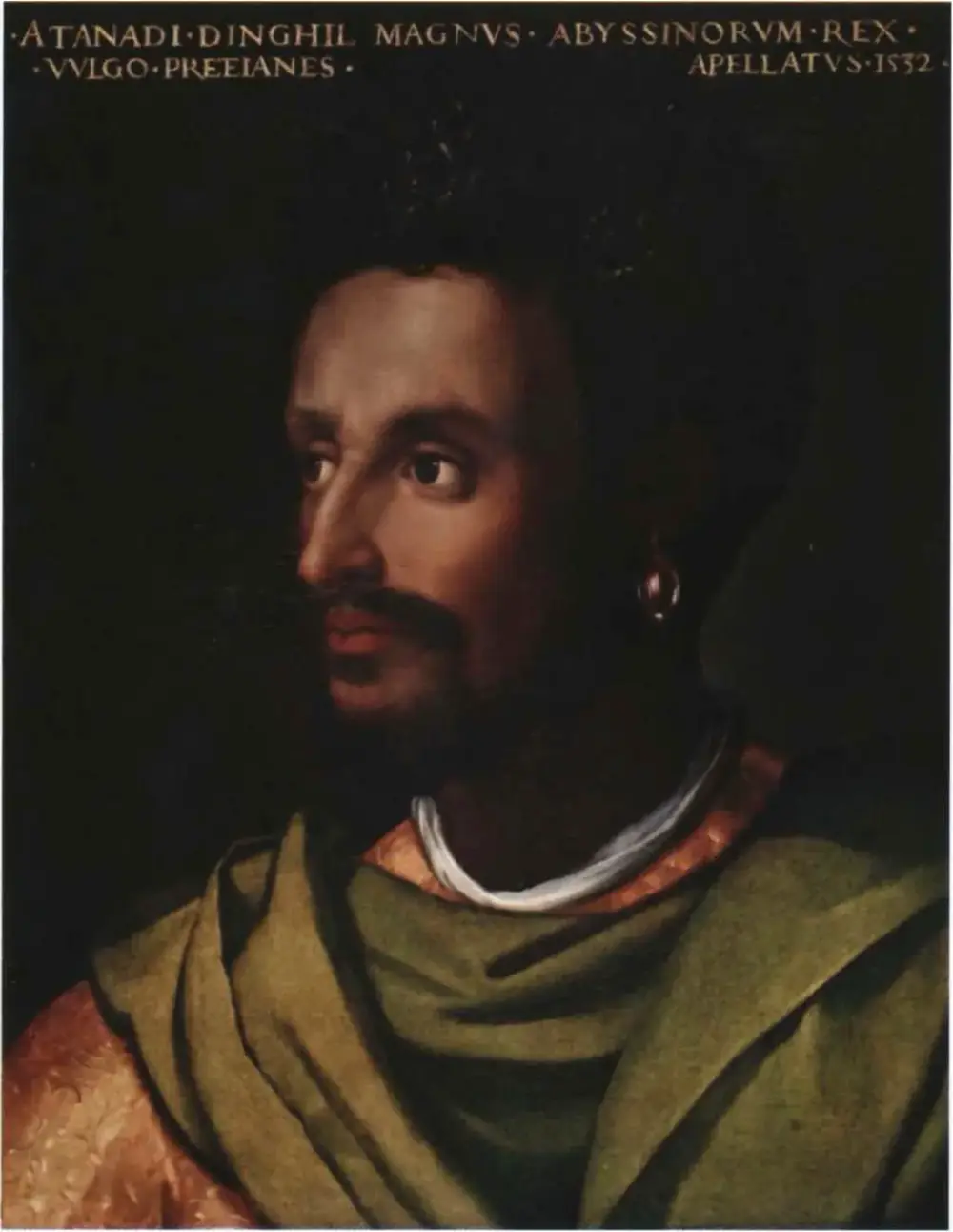 Painted head-and-shoulders portrait of a bearded man with dark skin and a gold earring, in a green cloak over a gold brocade robe, against a black background. A Latin inscription runs across the top.