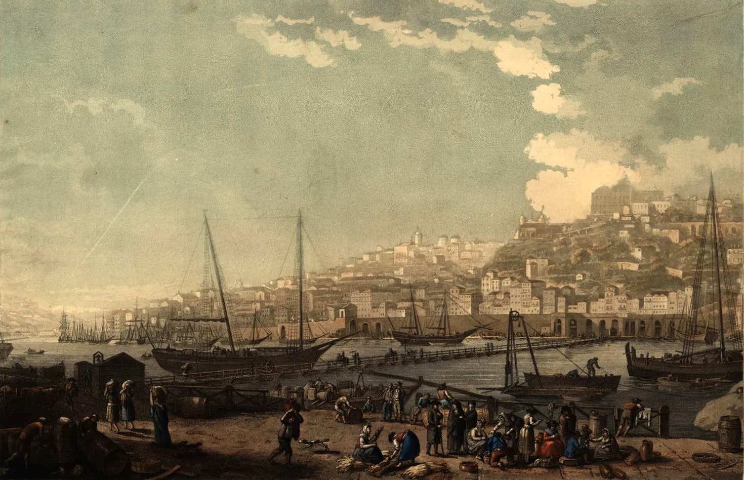 A tinted print of a busy riverside quay in the foreground, with porters, women carrying loads on their heads and barrels. A long, low wooden bridge resting on boats crosses the river to a town of tall houses behind an arcaded quay, climbing a hill to a large building on the summit. Sailing ships are moored along both banks.