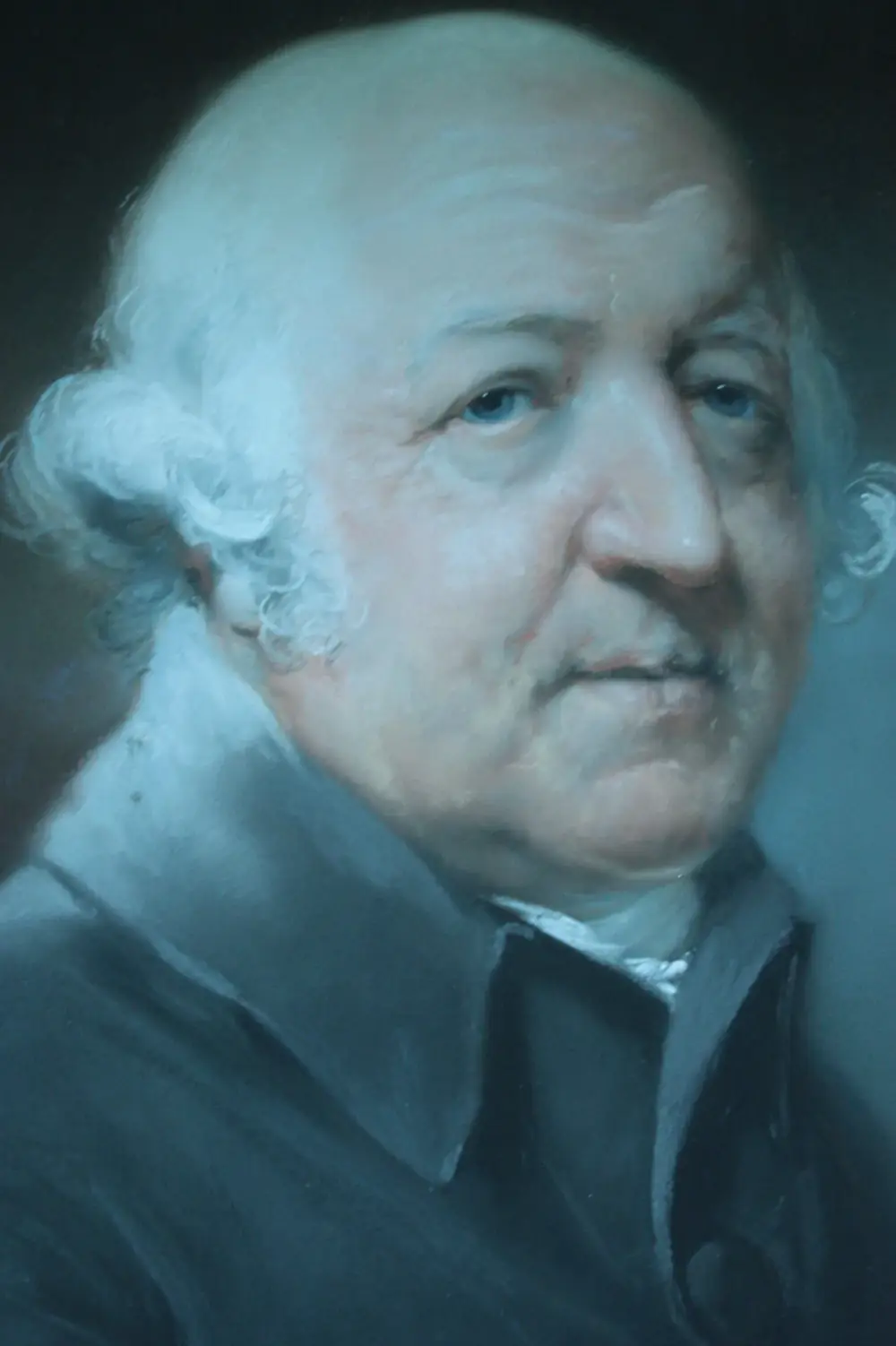 Pastel portrait detail of an elderly, heavy-set man with a bald crown and white side curls, in a dark coat with a white stock, looking sideways at the viewer.