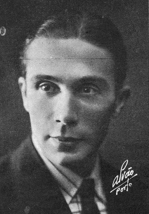 Head-and-shoulders studio portrait of a man with slicked-back hair, wearing a jacket and tie, with the studio signature Alvão, Porto in the lower right corner.