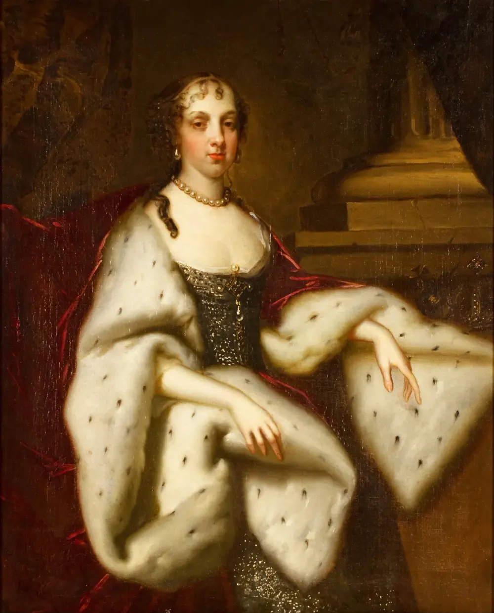 Portrait of a young woman with dark ringlets and a pearl necklace, wearing a dark silver-embroidered bodice under a voluminous ermine-lined robe and a red cloak, resting one arm on a stone plinth.