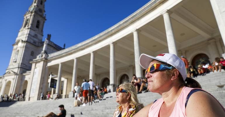 Pilgrims watch the eclipse at the Sanctuary of Fátima