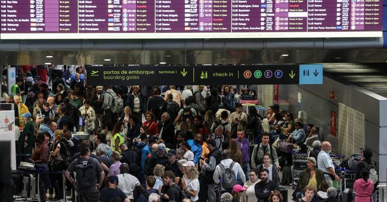 Long airport queues persist as passenger numbers surge