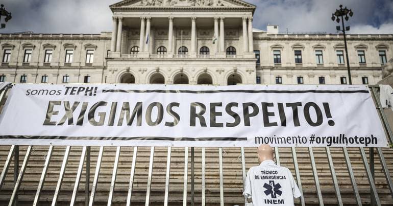 Emergency medical technicians protest outside Parliament