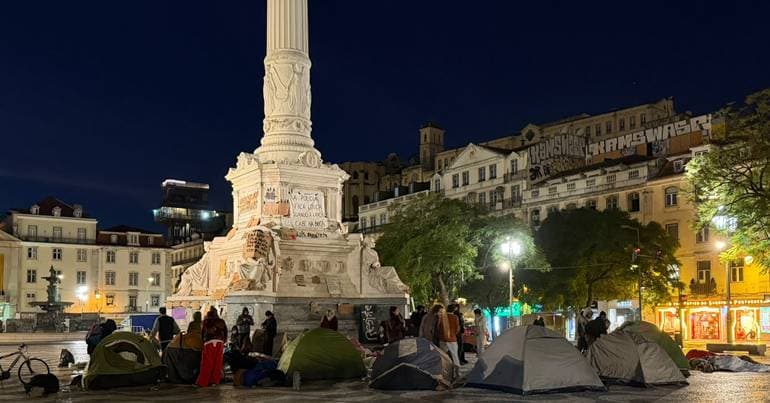 Protesters set up tents again after night in the open