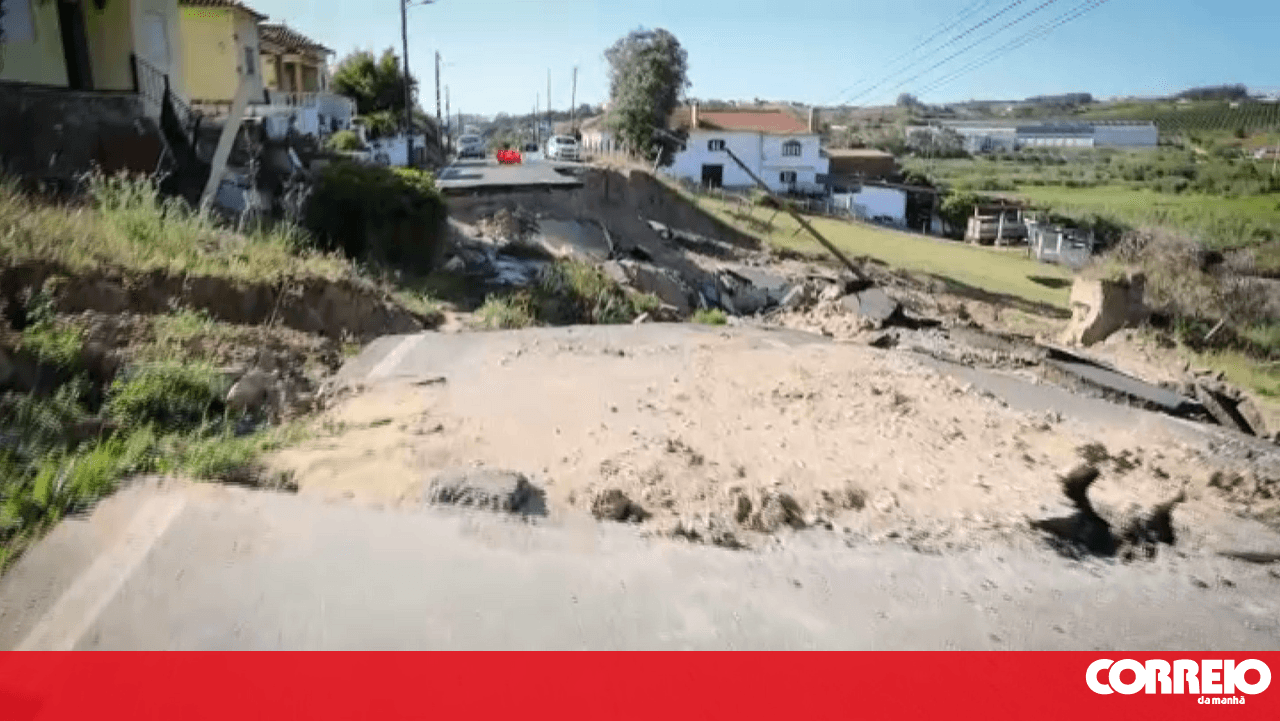 Residents cross a destroyed road every day in Casal Lourim. Rehabilitation works are only expected to finish in December