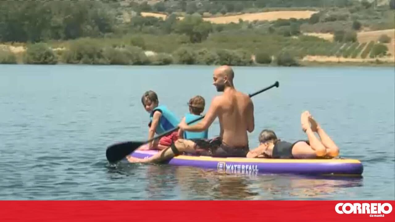 Bathers enjoy the heat with a trip to the river beach in Macedo de Cavaleiros