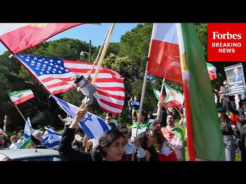 Demonstrators Outside Iranian Embassy In Lisbon, Portugal, Celebrate U.S.-Israeli Strikes On Iran