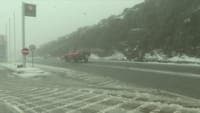 Snowploughs on the road. Heavy snow across Portugal