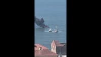 Images of a boat on fire off the coast of Lisbon